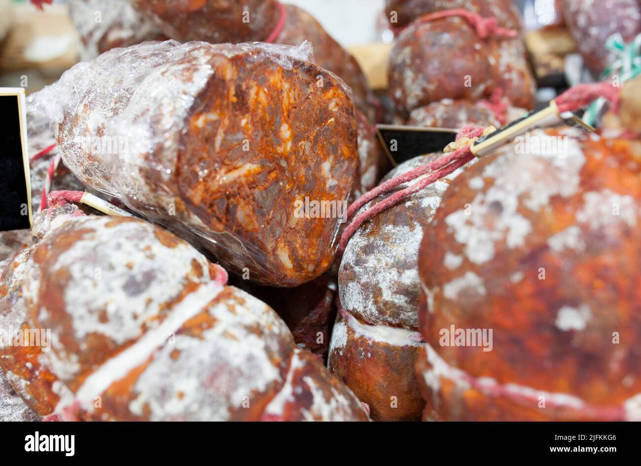 Iberian morcon displayed at street market stall. Selective focus. Stock Photo