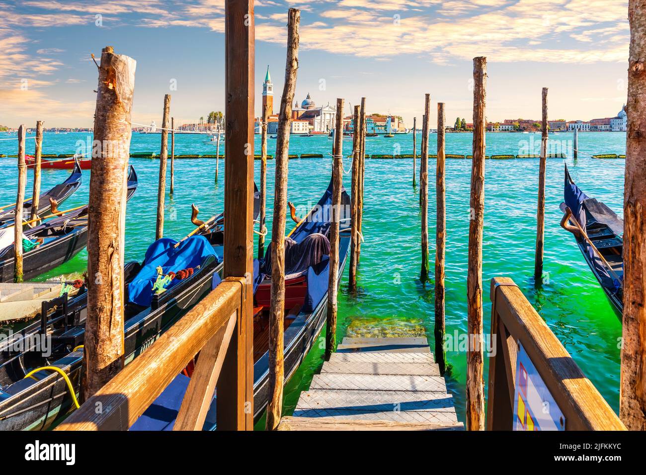 Gondolas moored in the Grand Canal in front of San Giorgio Maggiore Island, Venice, Italy. Stock Photo