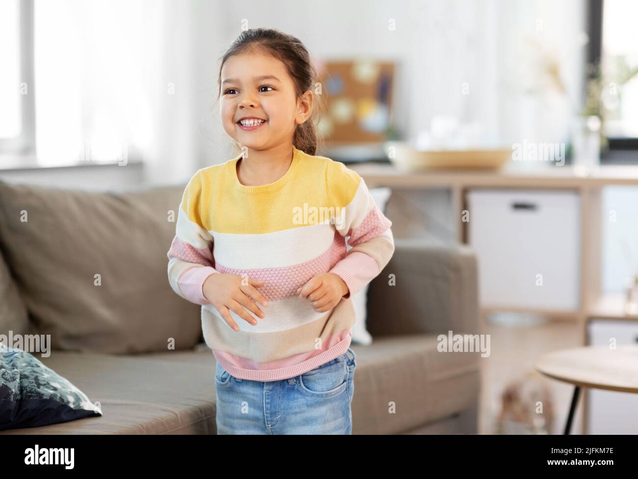 happy smiling little girl at home Stock Photo - Alamy