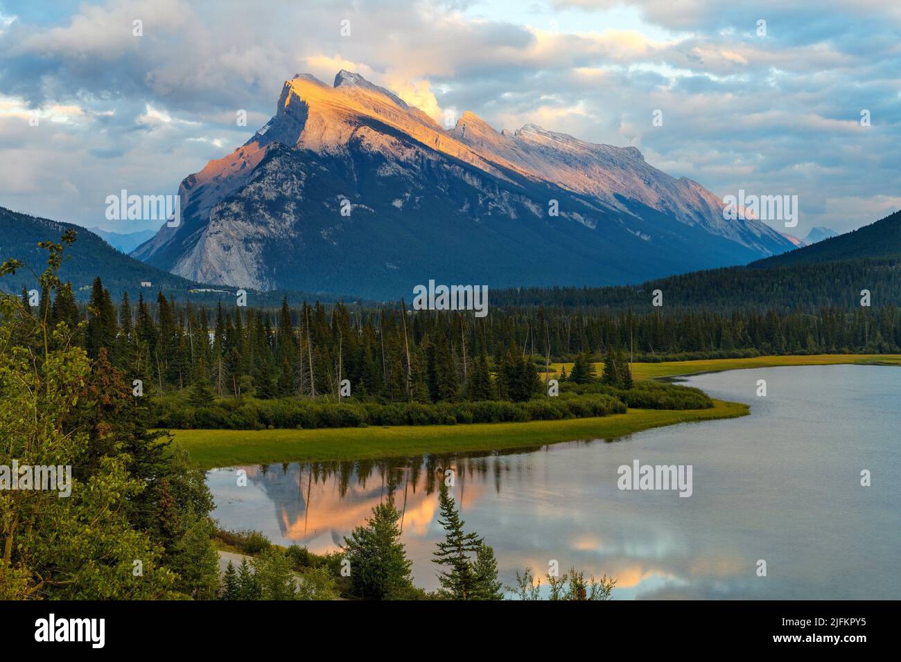 Bright colorful sunset over Mount Rundle (2949 M) with the Vermilion Lakes in the foreground in the Banff National Park, Alberta, Canada. Stock Photo