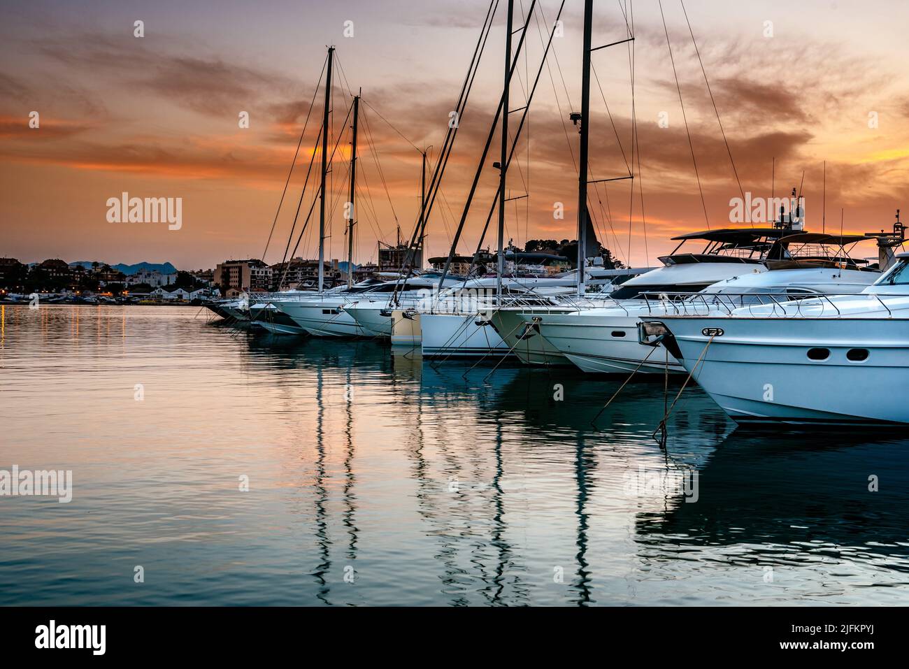 Luxury yachts moored in the Marina of Denia at sunset. Alicante, Spain. Stock Photo