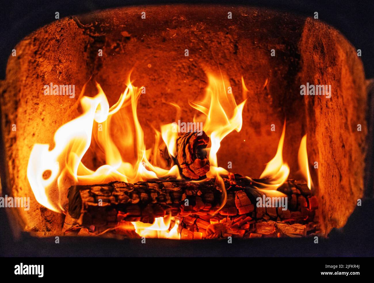 Flame of Wooden logs being burn inside stove Stock Photo Alamy