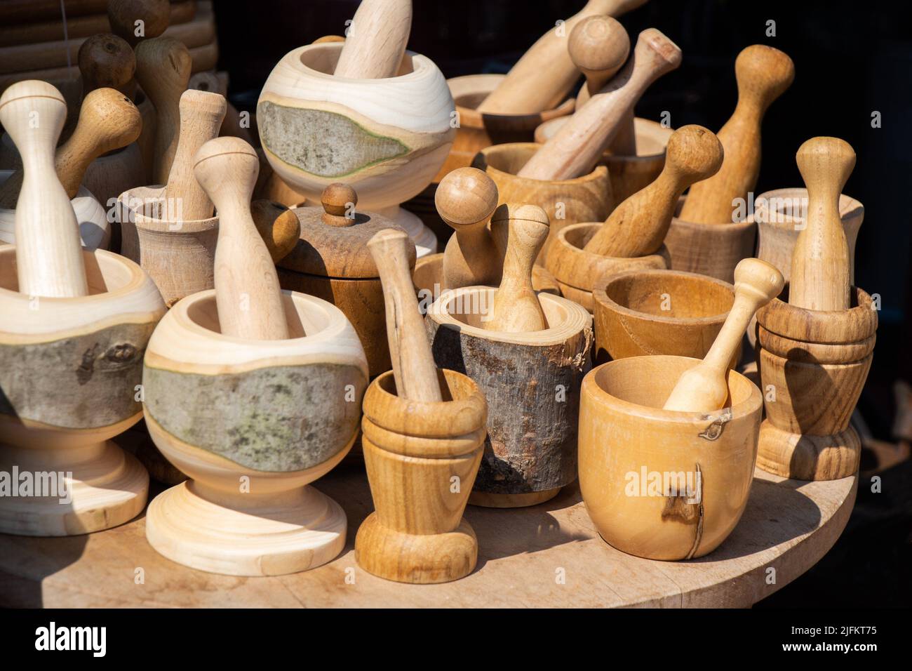 wooden mortars and pestles as a traditional kitchenware. Stock Photo