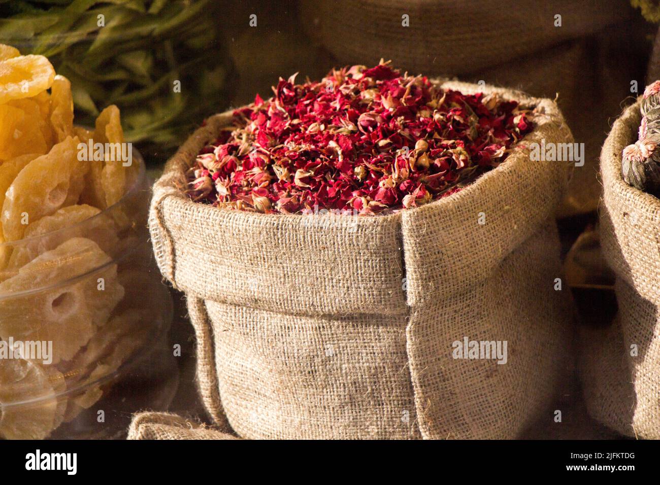 Dry herbal plants at in sacks at the market. Stock Photo