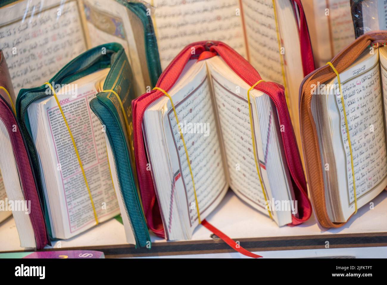 Islamic Holy Book Quran on the market shelf Stock Photo - Alamy