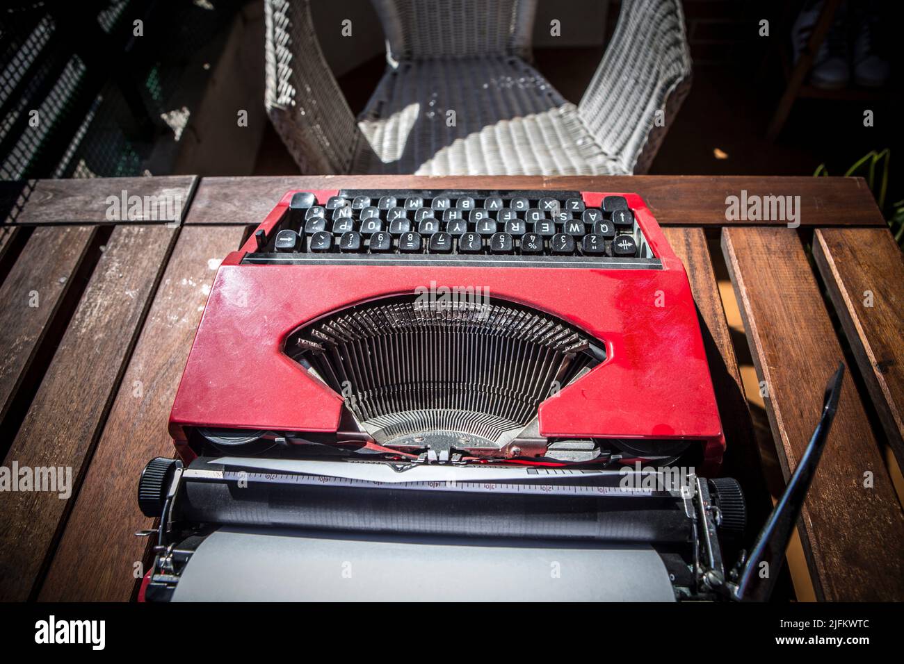 Urban home terrace with 1970s typewriter. The Blank Page Challenge concept. Stock Photo
