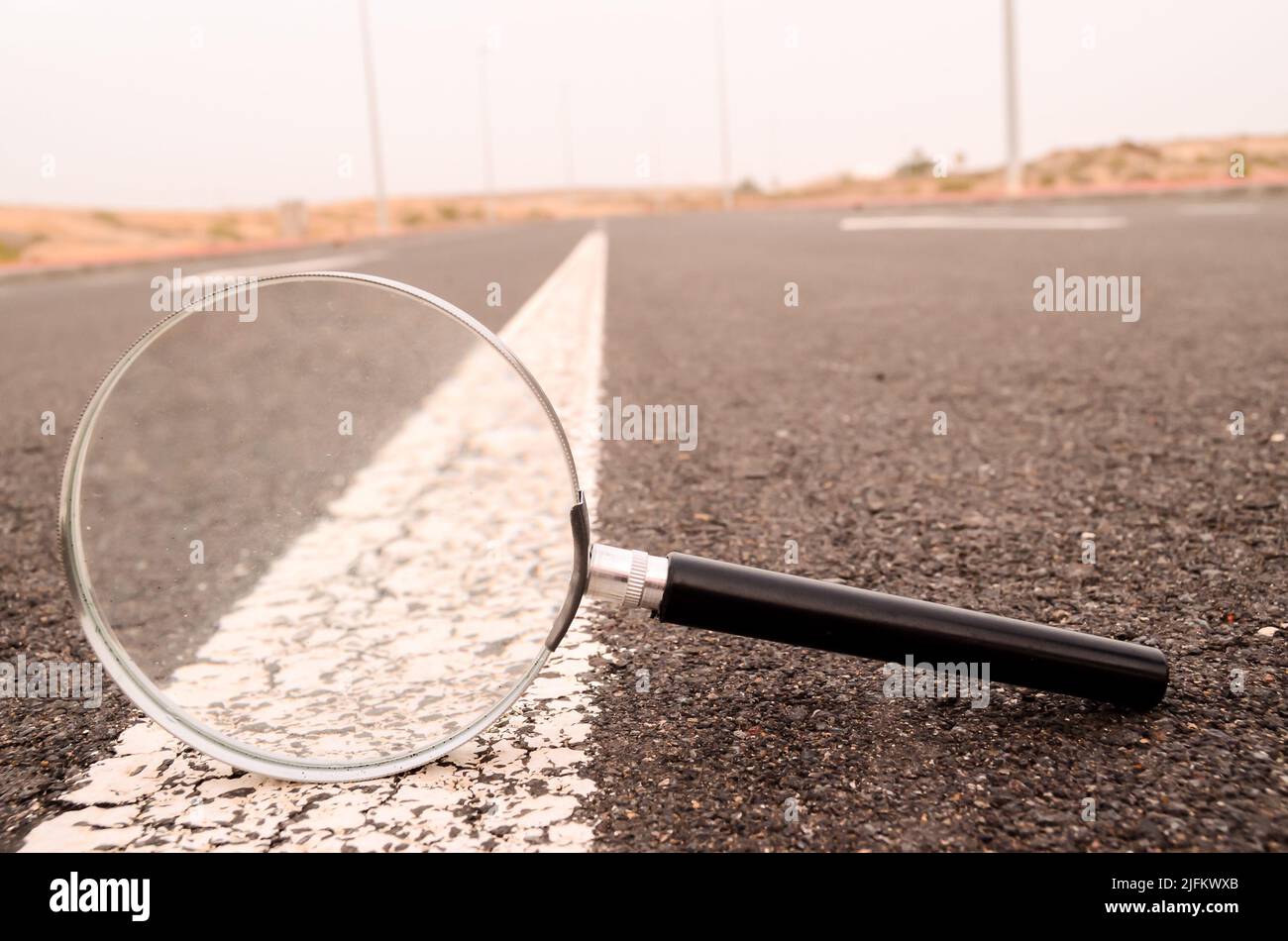 Travel Concept Magnify Glass Loupe on the Asphlat Road Stock Photo Alamy