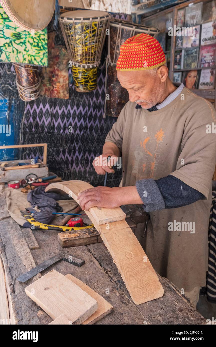 craftsman luthier making a musical instrument, Essaouira, morocco