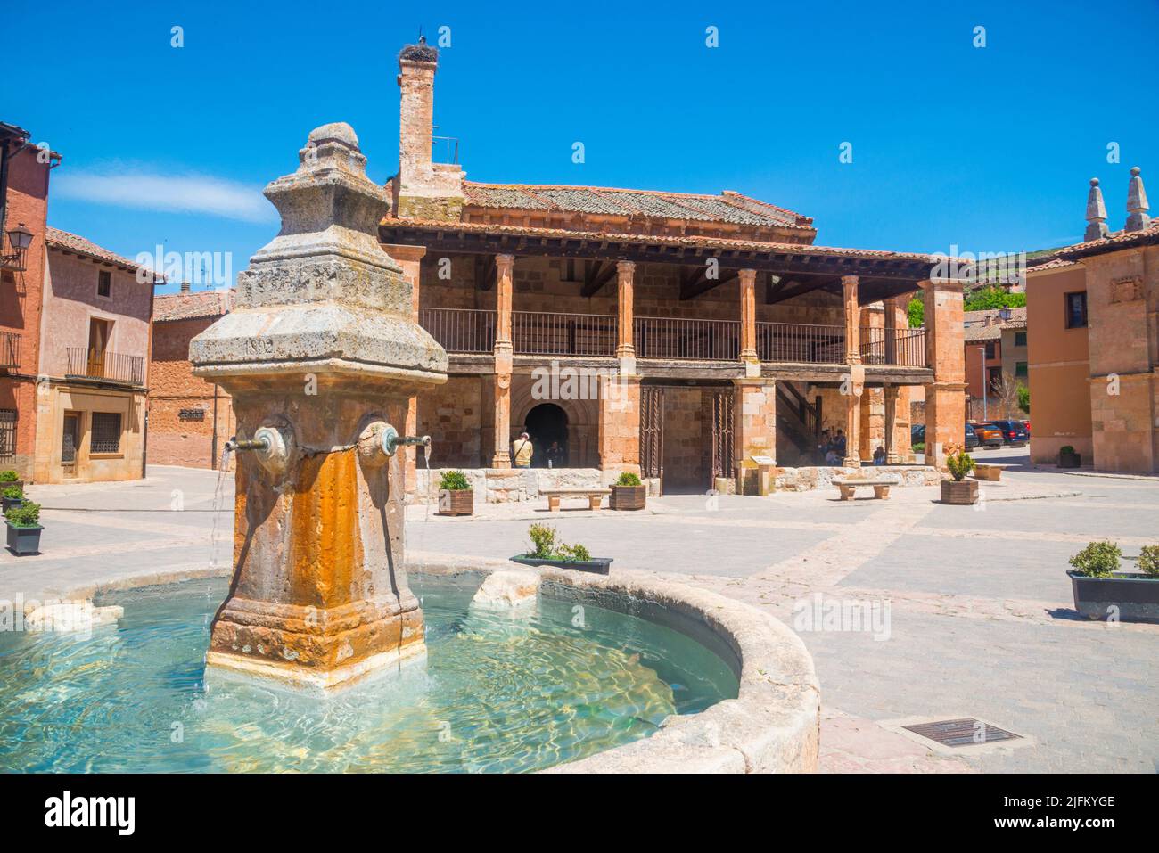 Fountain and San Miguel church. Plaza Mayor, Ayllon, Segovia province, Castilla Leon, Spain. Stock Photo