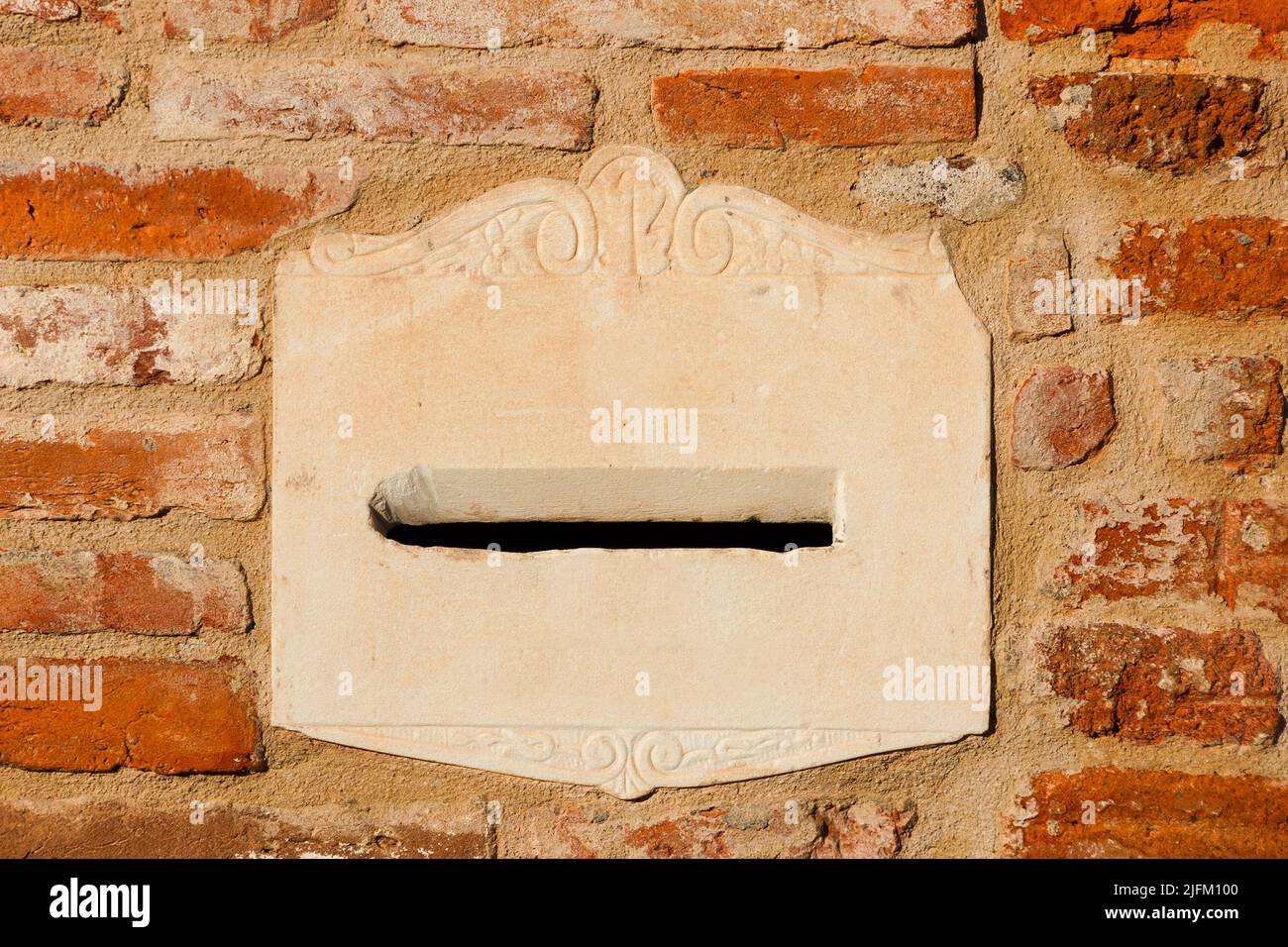 Old mailbox on a red brick wall as bakground Stock Photo