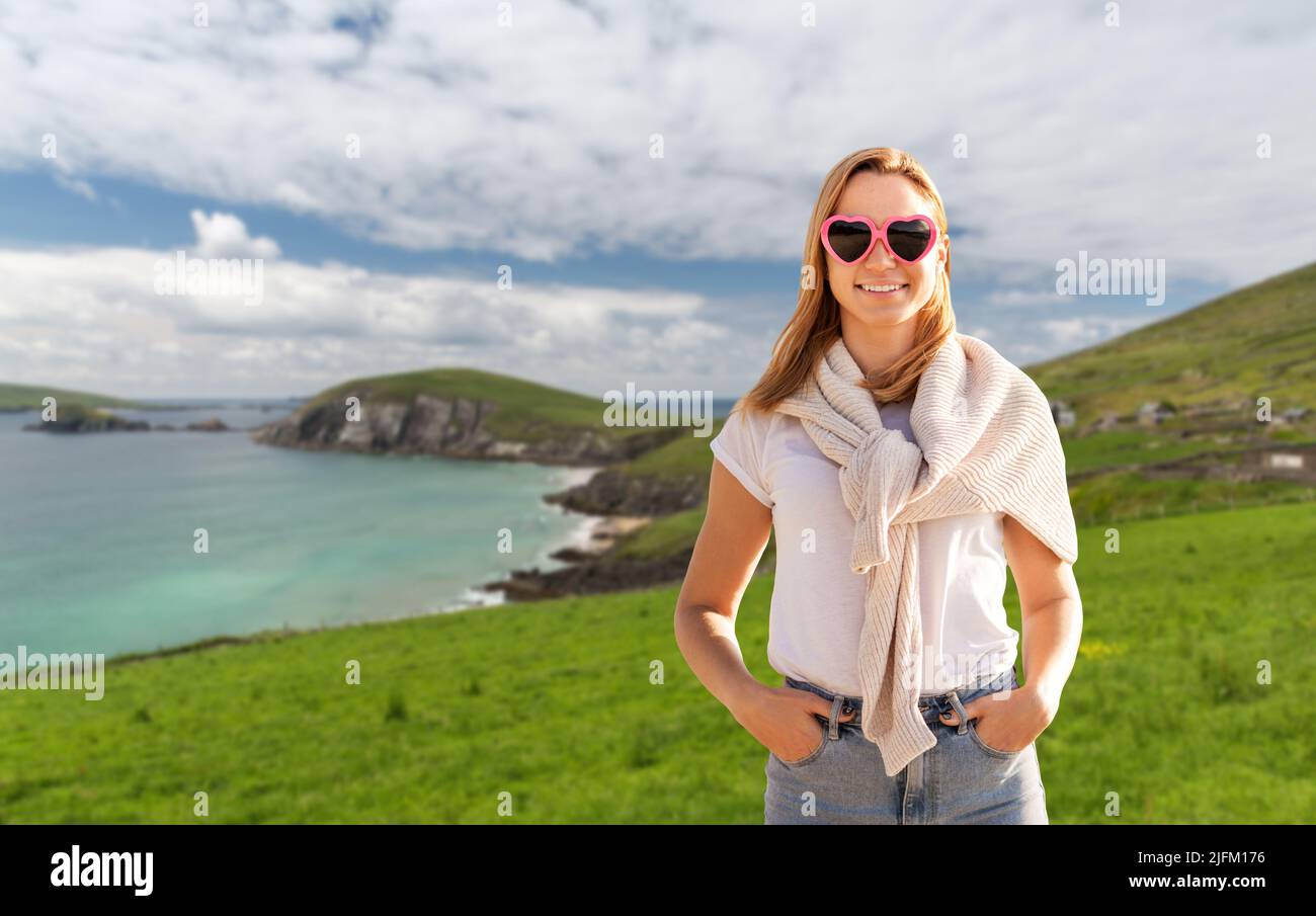 woman wearing heartshaped sunglasses in ireland Stock Photo Alamy