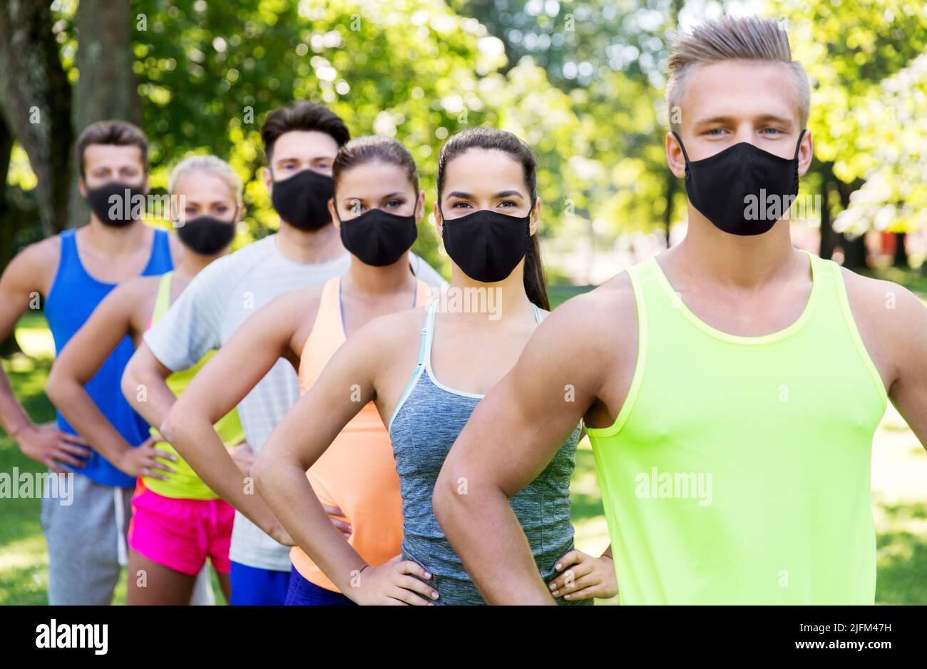 group of happy friends or sportsmen at summer park Stock Photo Alamy