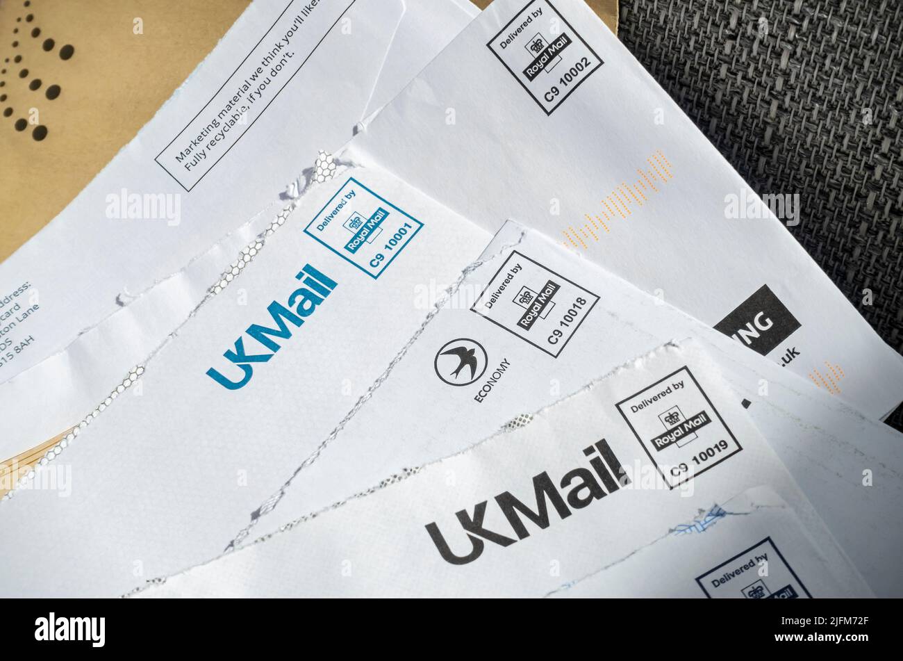 Close up of a pile of used UKMail Royal Mail franked stamped letter letters envelope envelopes England UK United Kingdom GB Great Britain Stock Photo