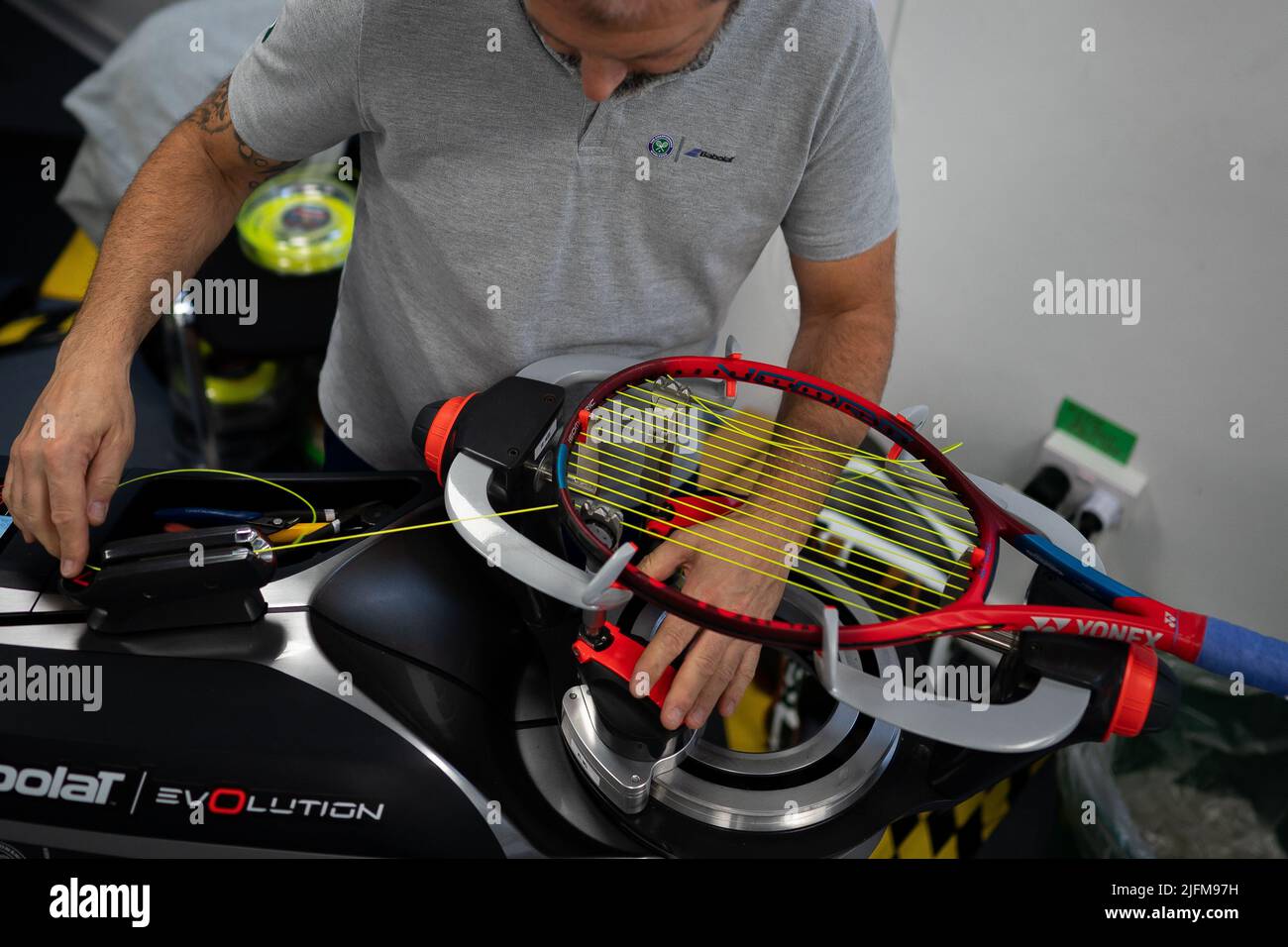 A racket being strung in the Stringing Room on day eight of the 2022 ...