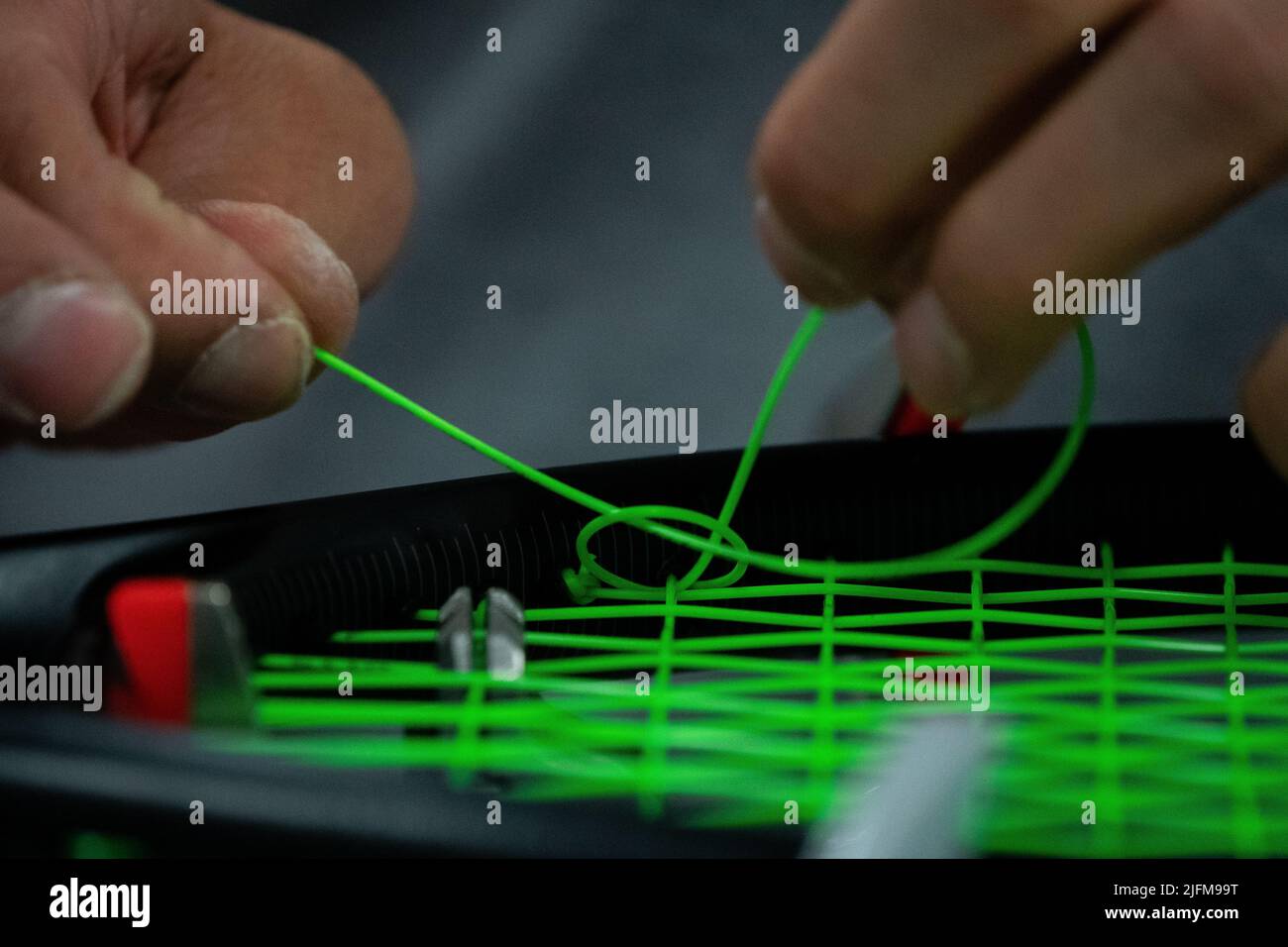 A racket after being re-strung in the Stringing Room on day eight of ...
