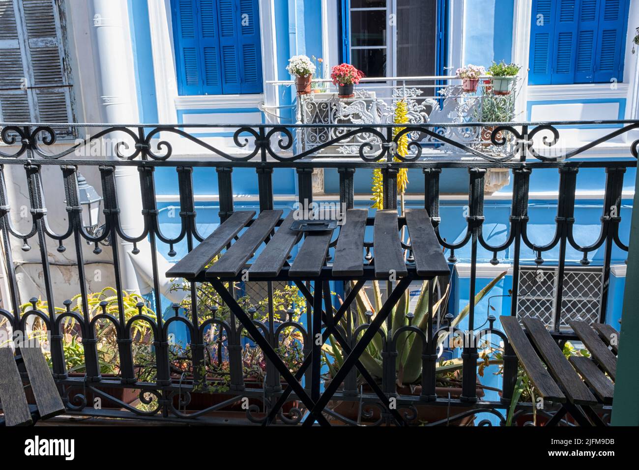 View from balcony in Greek street in Nafplio, Greece Stock Photo