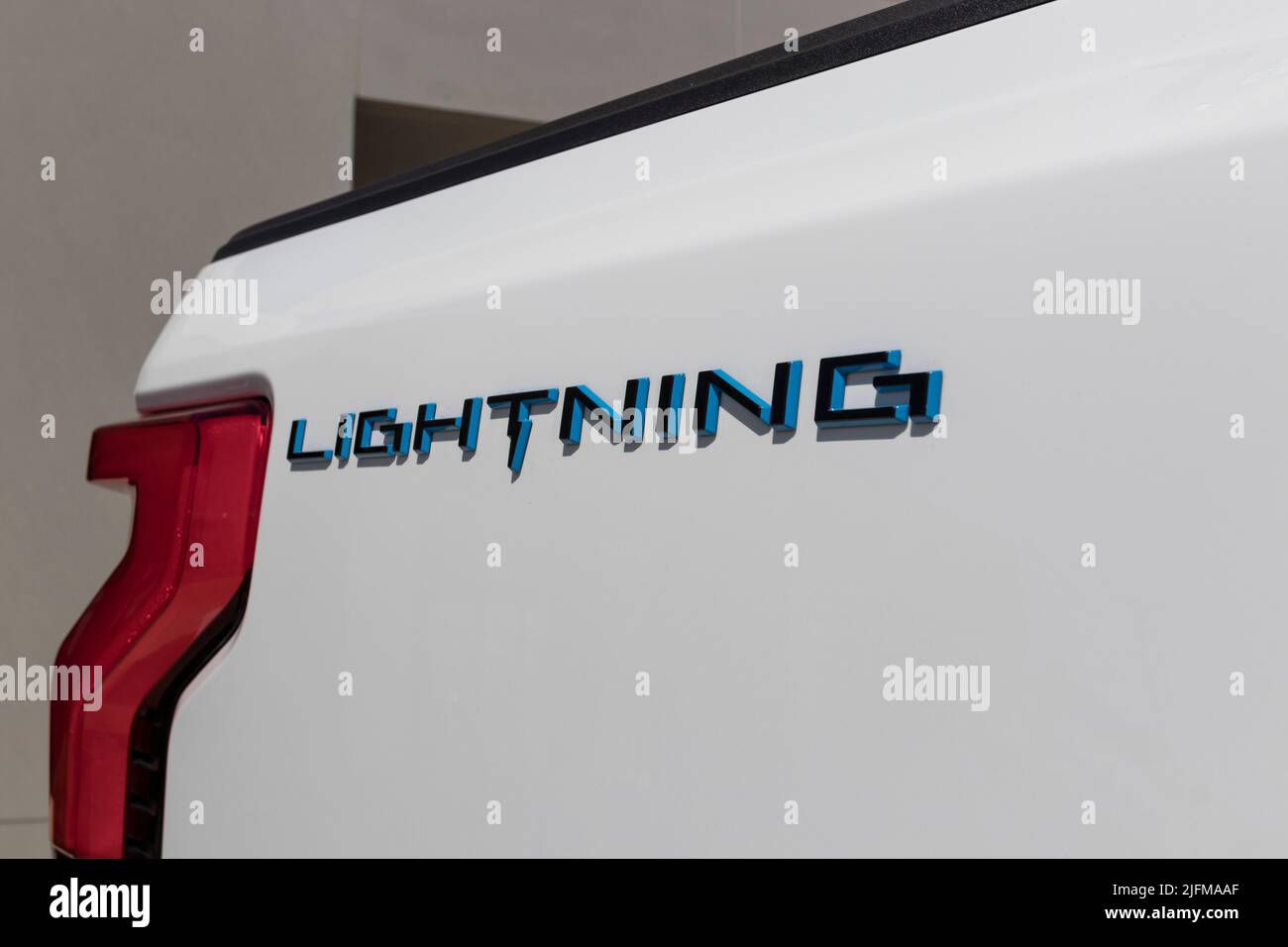 Zionsville - Circa June 2022: Ford F-150 Lightning display. Ford offers the F150 Lightning all-electric truck in Pro, XLT, Lariat, and Platinum models Stock Photo