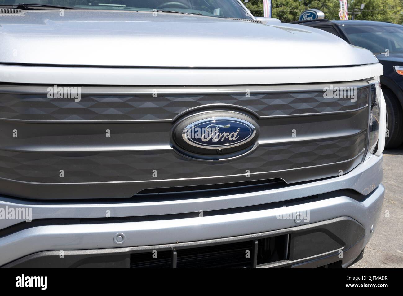 Tipton - Circa July 2022: Ford F-150 Lightning display. Ford offers the F150 Lightning all-electric truck in Pro, XLT, Lariat, and Platinum models. Stock Photo