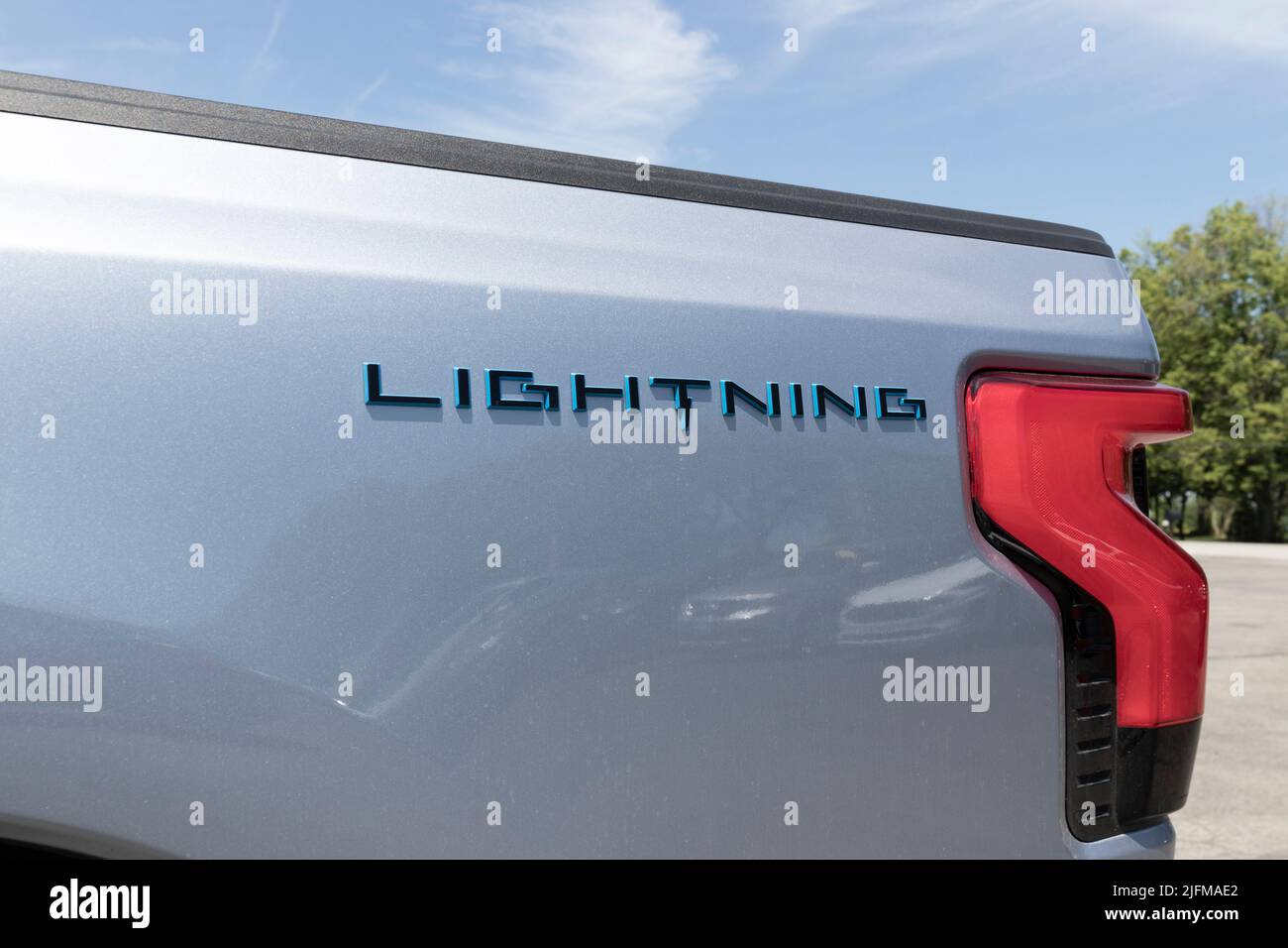 Tipton - Circa July 2022: Ford F-150 Lightning display. Ford offers the F150 Lightning all-electric truck in Pro, XLT, Lariat, and Platinum models. Stock Photo