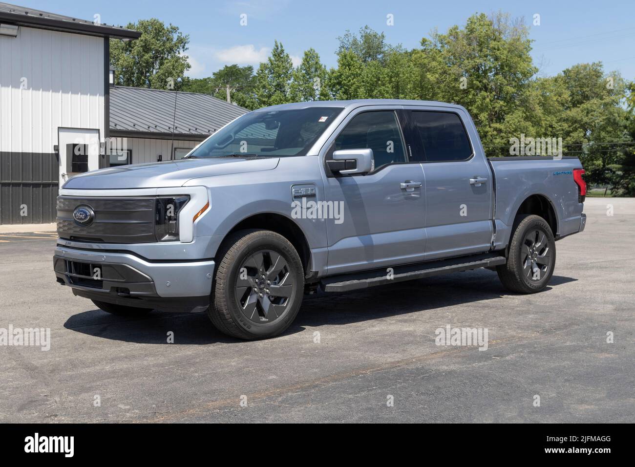 Tipton - Circa July 2022: Ford F-150 Lightning display. Ford offers the F150 Lightning all-electric truck in Pro, XLT, Lariat, and Platinum models. Stock Photo