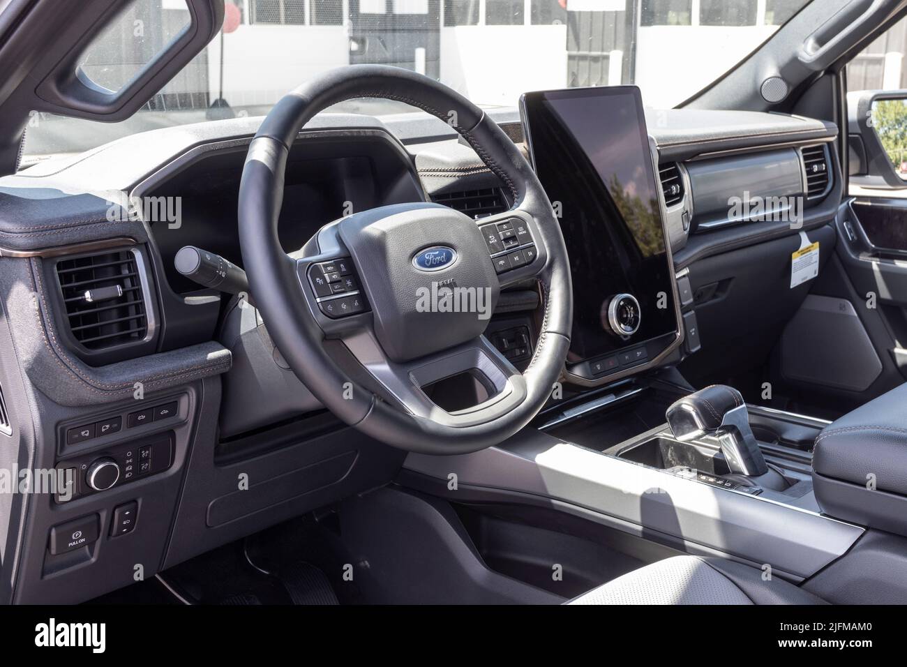 Tipton - Circa July 2022: Ford F-150 Lightning Infotainment display. Ford offers the F150 Lightning all-electric truck in Pro, XLT, Lariat, and Platin Stock Photo