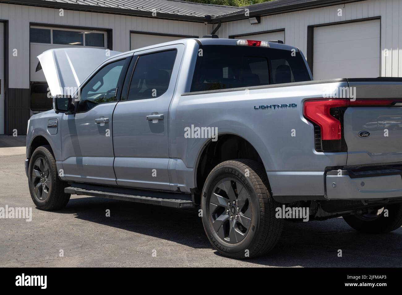 Tipton - Circa July 2022: Ford F-150 Lightning Frunk display. Ford offers the F150 Lightning all-electric truck in Pro, XLT, Lariat, and Platinum mode Stock Photo