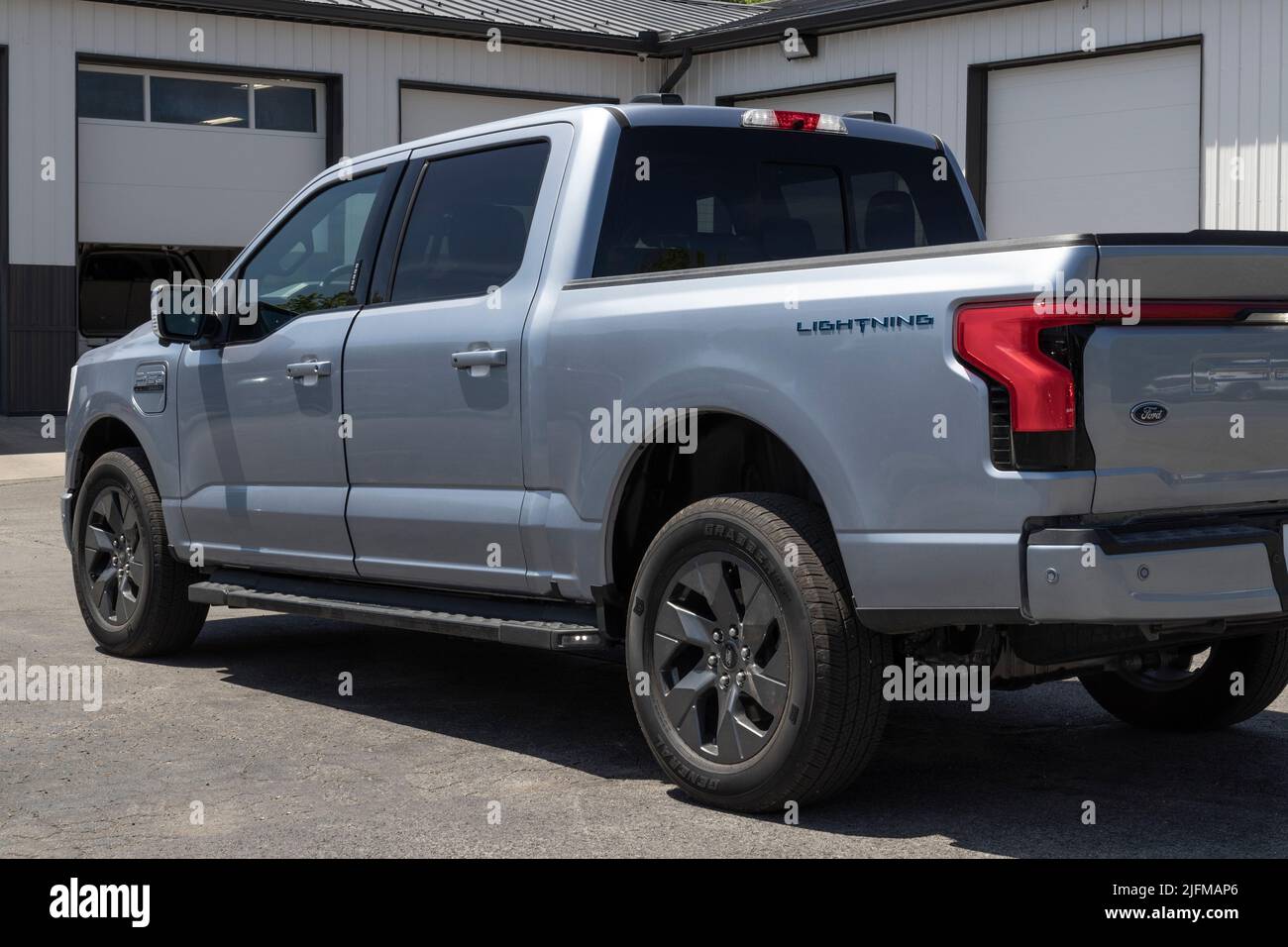 Tipton - Circa July 2022: Ford F-150 Lightning display. Ford offers the F150 Lightning all-electric truck in Pro, XLT, Lariat, and Platinum models. Stock Photo