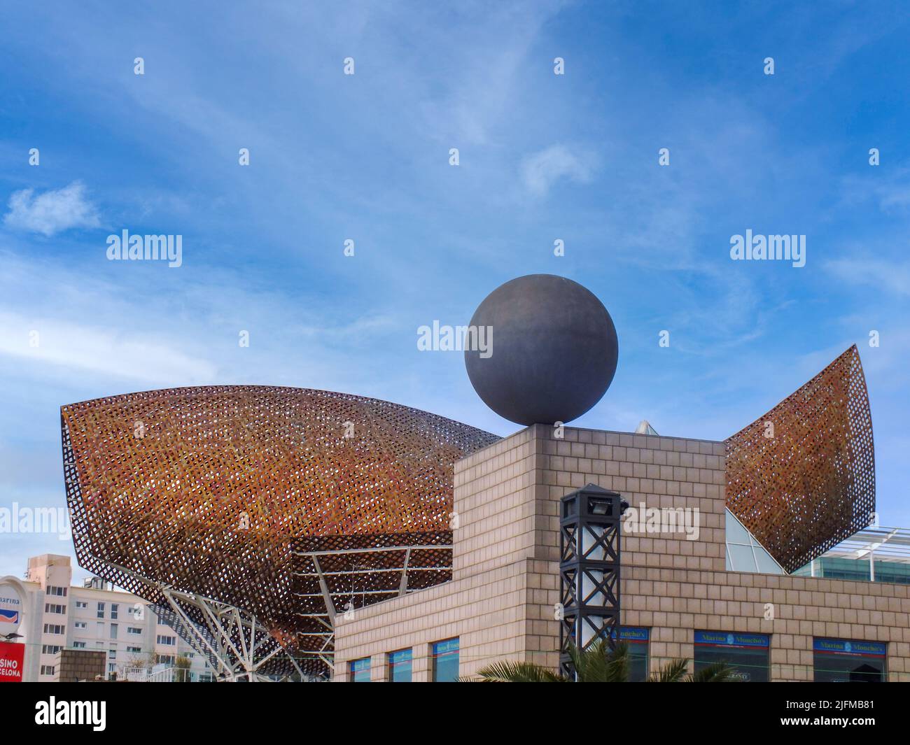 Frank Gehry's sphere sculpture in front of Fish Sculpture for Olympic village at Port Olimpic Marina in Barcelona, Spain, Famous Peix, Gold Fish Stock Photo