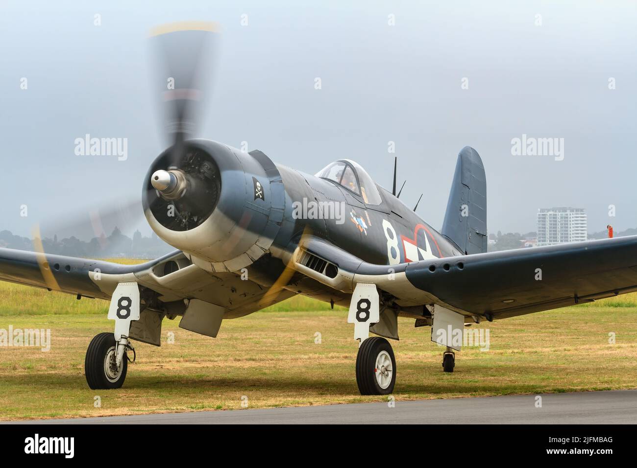 A F4U Corsair, an American fighter aircraft of WW2, on the ground at an airshow Stock Photo