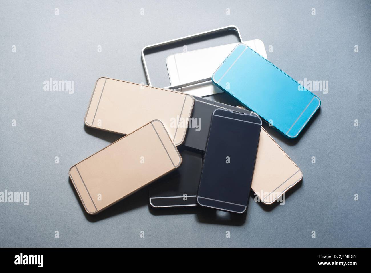 Plastic mobile phone cases variety on gray Stock Photo