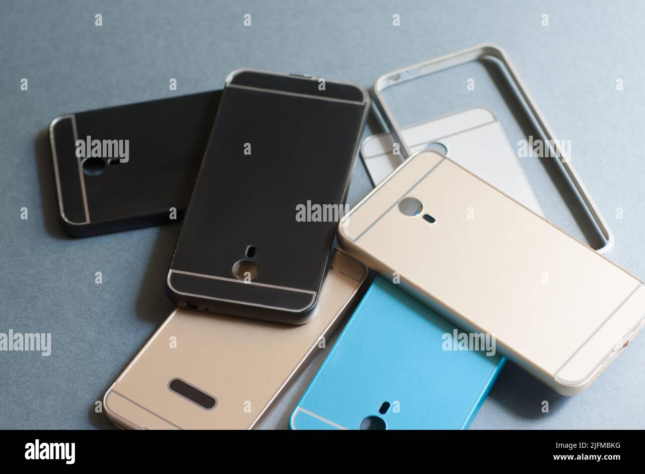 Plastic mobile phone cases variety on gray Stock Photo