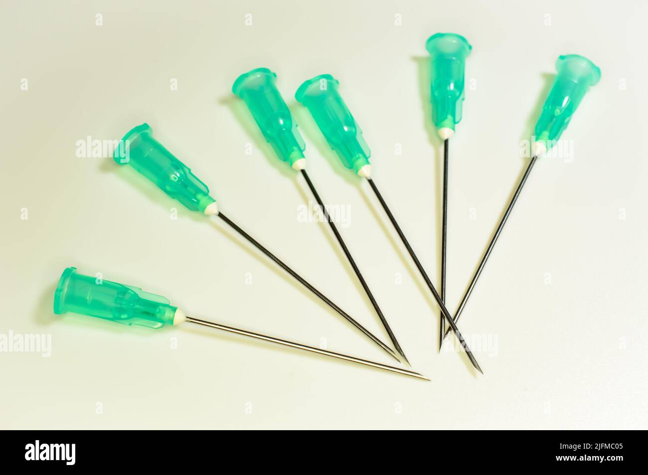 Medical syringe's needles compilation on a white background. Social problems.  Drugs and medical treatment. Stock Photo