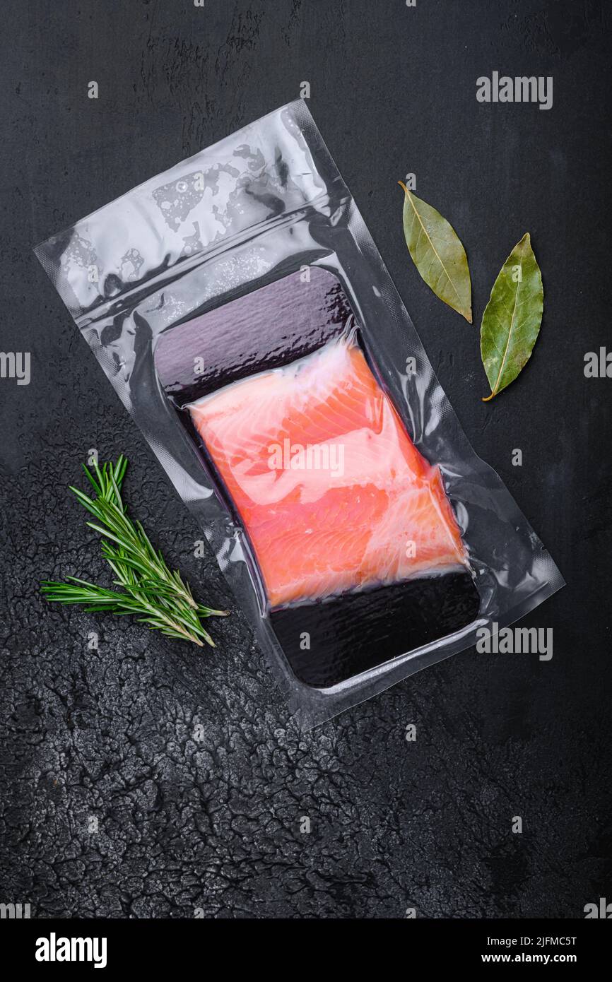 Fresh salmon fillet cut set, on black dark stone table background, top ...