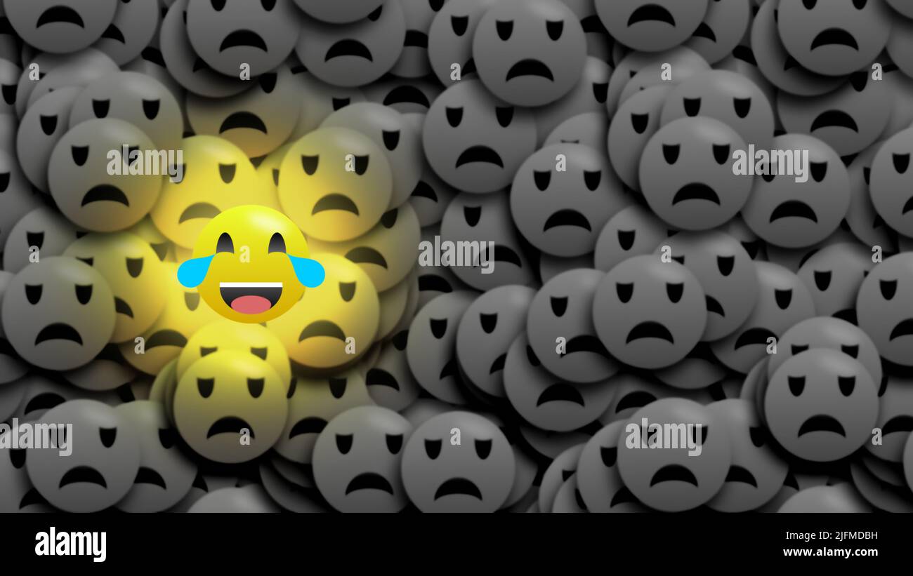 Funny laugh emoji in bright gold colour. Funny emoji and little blur sad emoji showing fun is life. Stock Photo