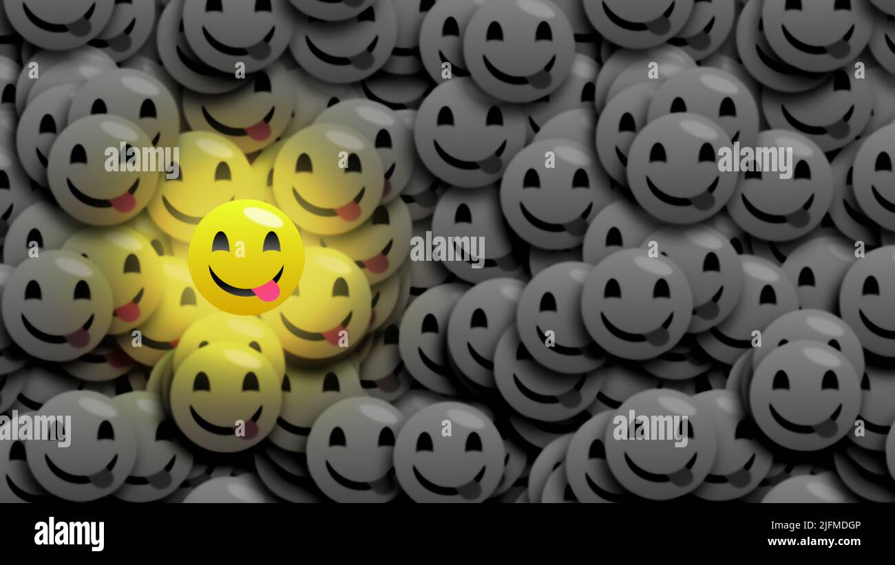 bright tasty emoji isolated on other black and white dark emoji. Stock Photo