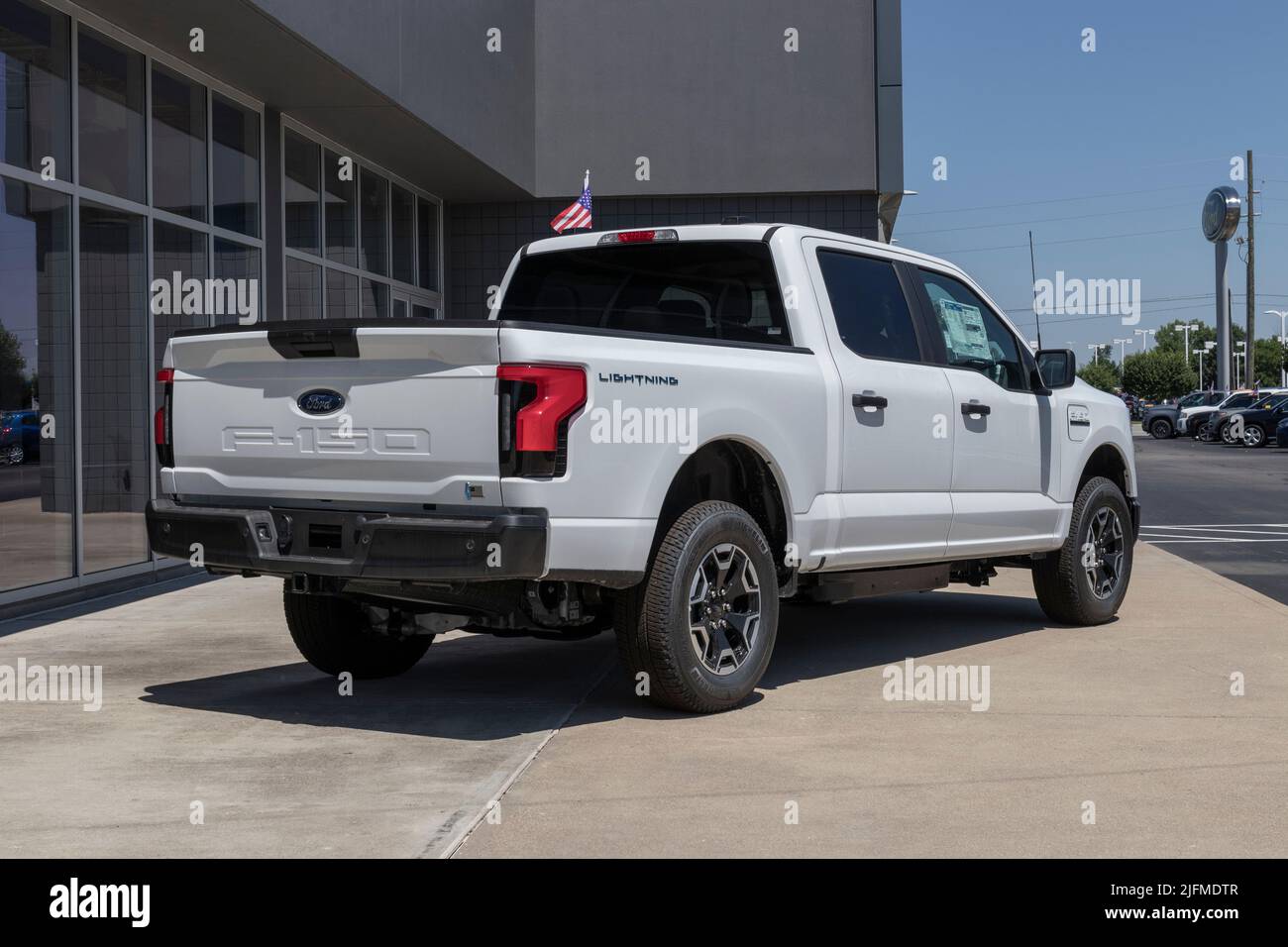 Plainfield - Circa July 2022: Ford F-150 Lightning display. Ford offers the F150 Lightning all-electric truck in Pro, XLT, Lariat, and Platinum models Stock Photo