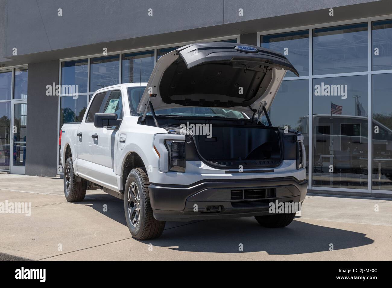 Plainfield - Circa July 2022: Ford F-150 Lightning Frunk display. Ford offers the F150 Lightning all-electric truck in Pro, XLT, Lariat, and Platinum Stock Photo