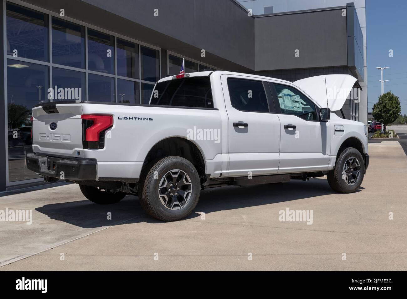 Plainfield - Circa July 2022: Ford F-150 Lightning Frunk display. Ford offers the F150 Lightning all-electric truck in Pro, XLT, Lariat, and Platinum Stock Photo