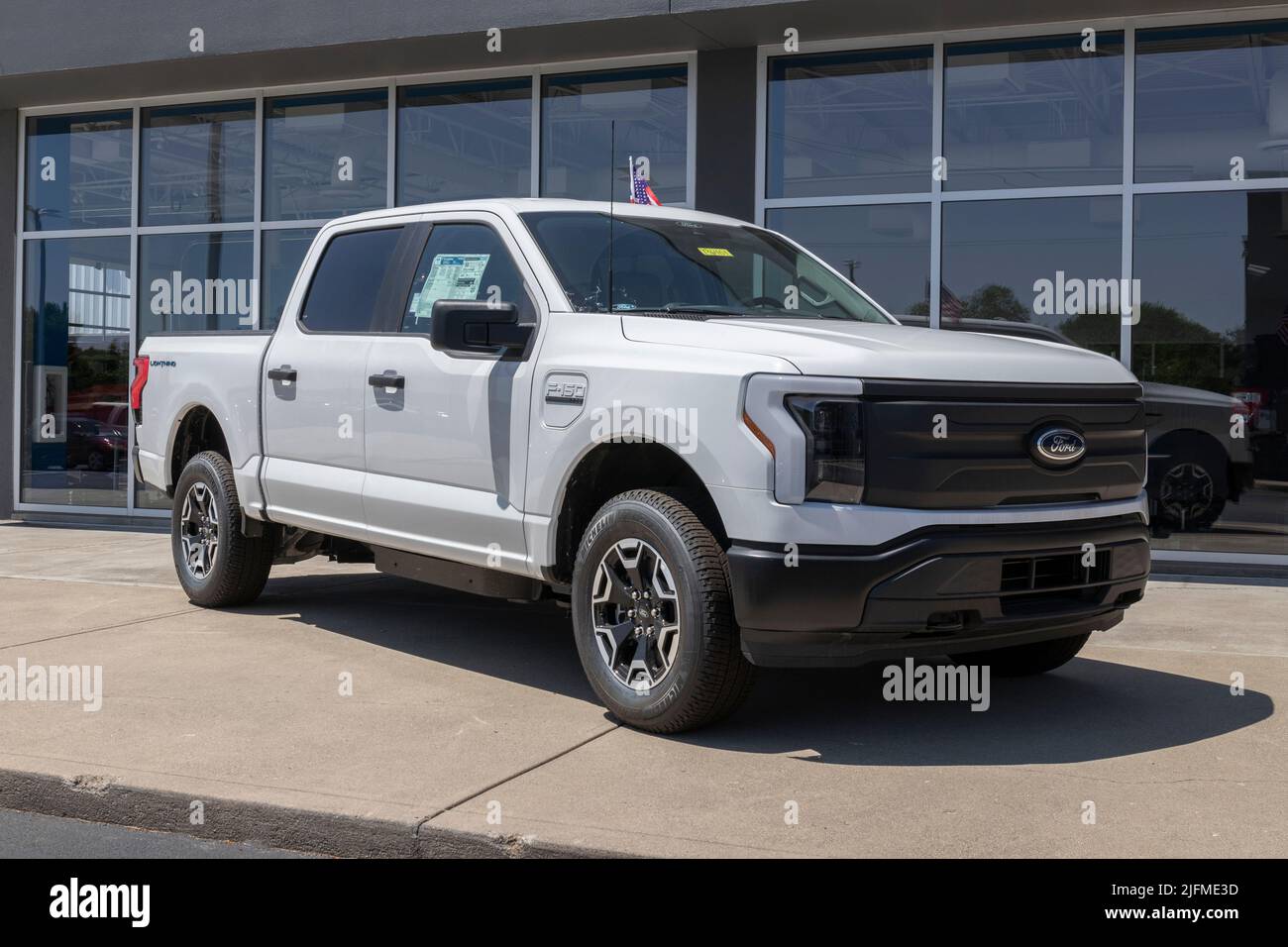 Plainfield - Circa July 2022: Ford F-150 Lightning display. Ford offers the F150 Lightning all-electric truck in Pro, XLT, Lariat, and Platinum models Stock Photo