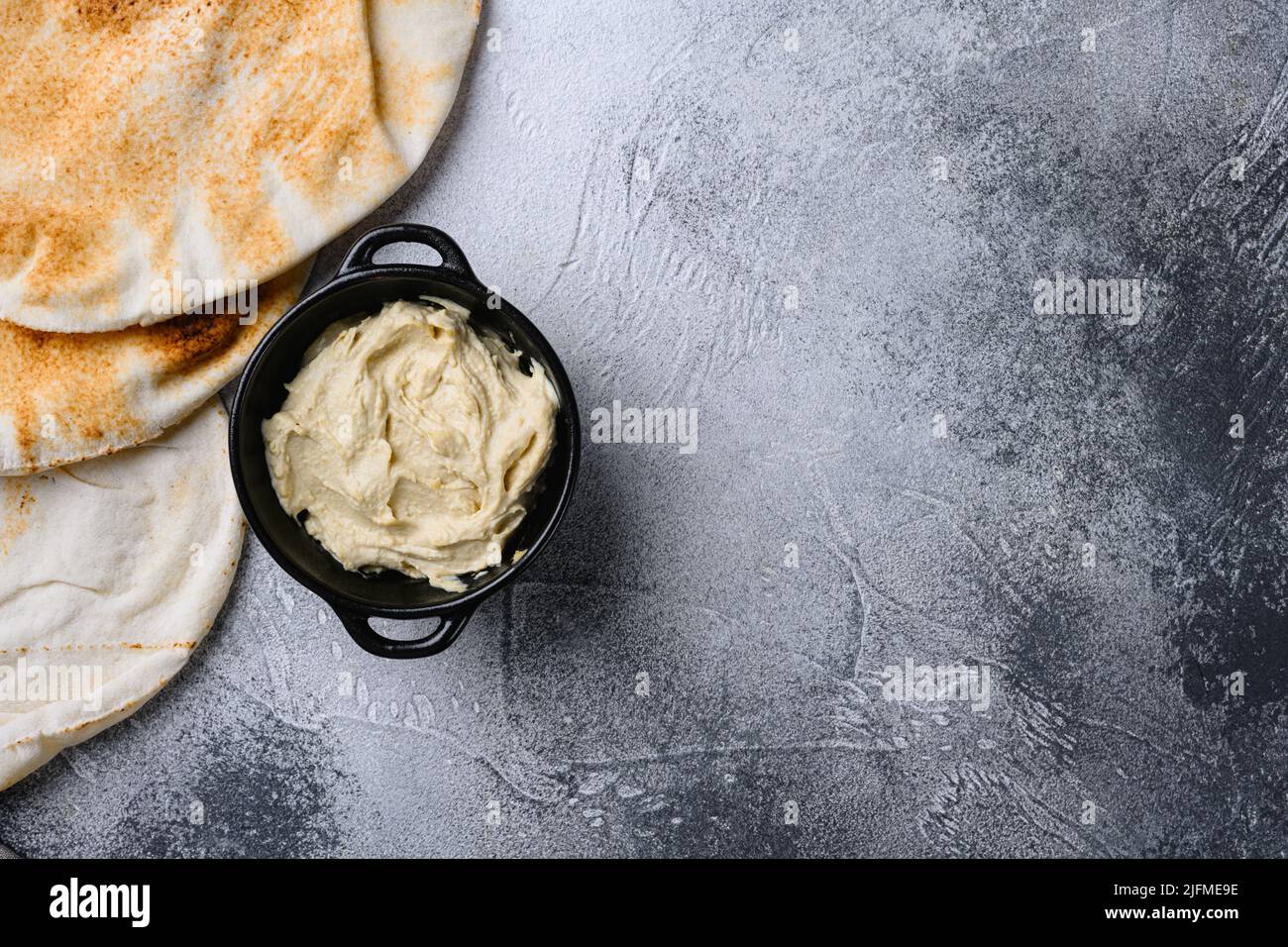 Healthy Creamy Hummus set, on gray stone table background, top view ...