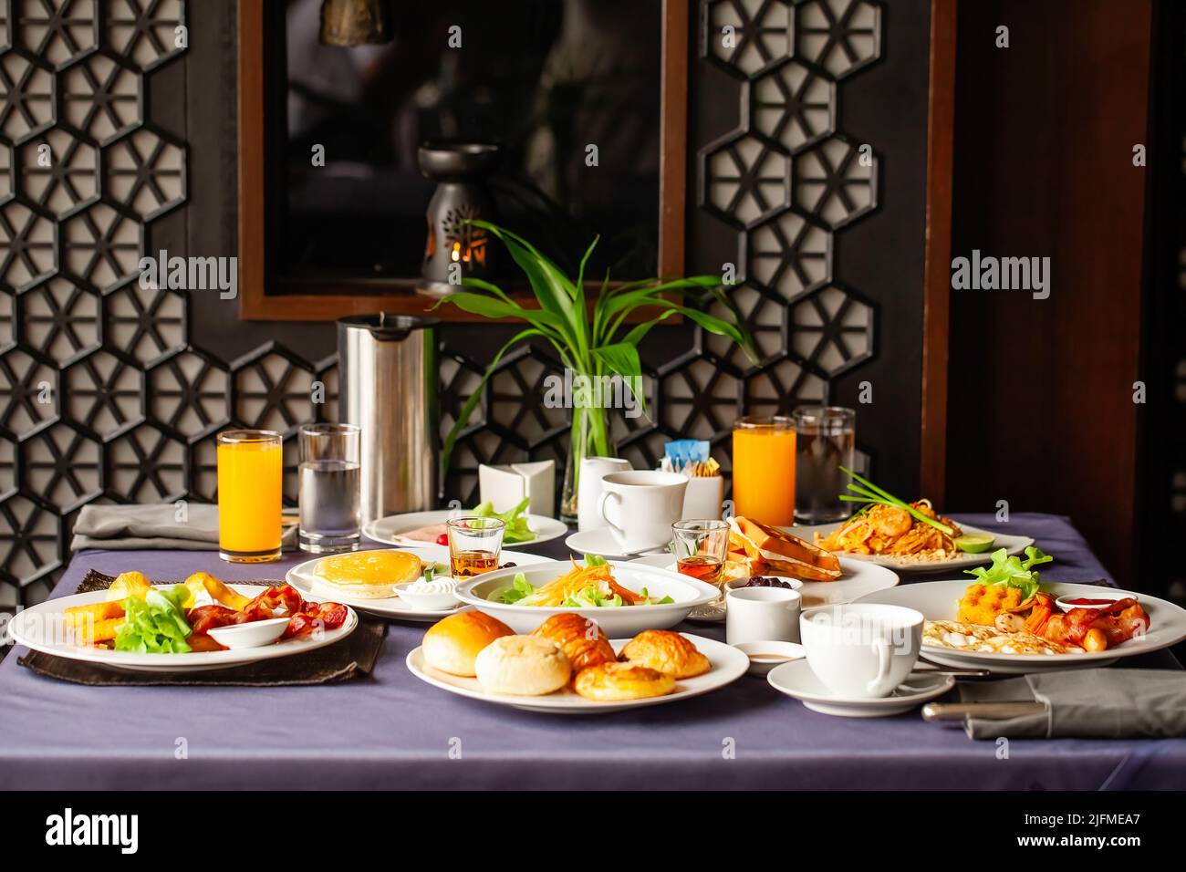 Food and drinks served on table for two persons on breakfast or brunch ...