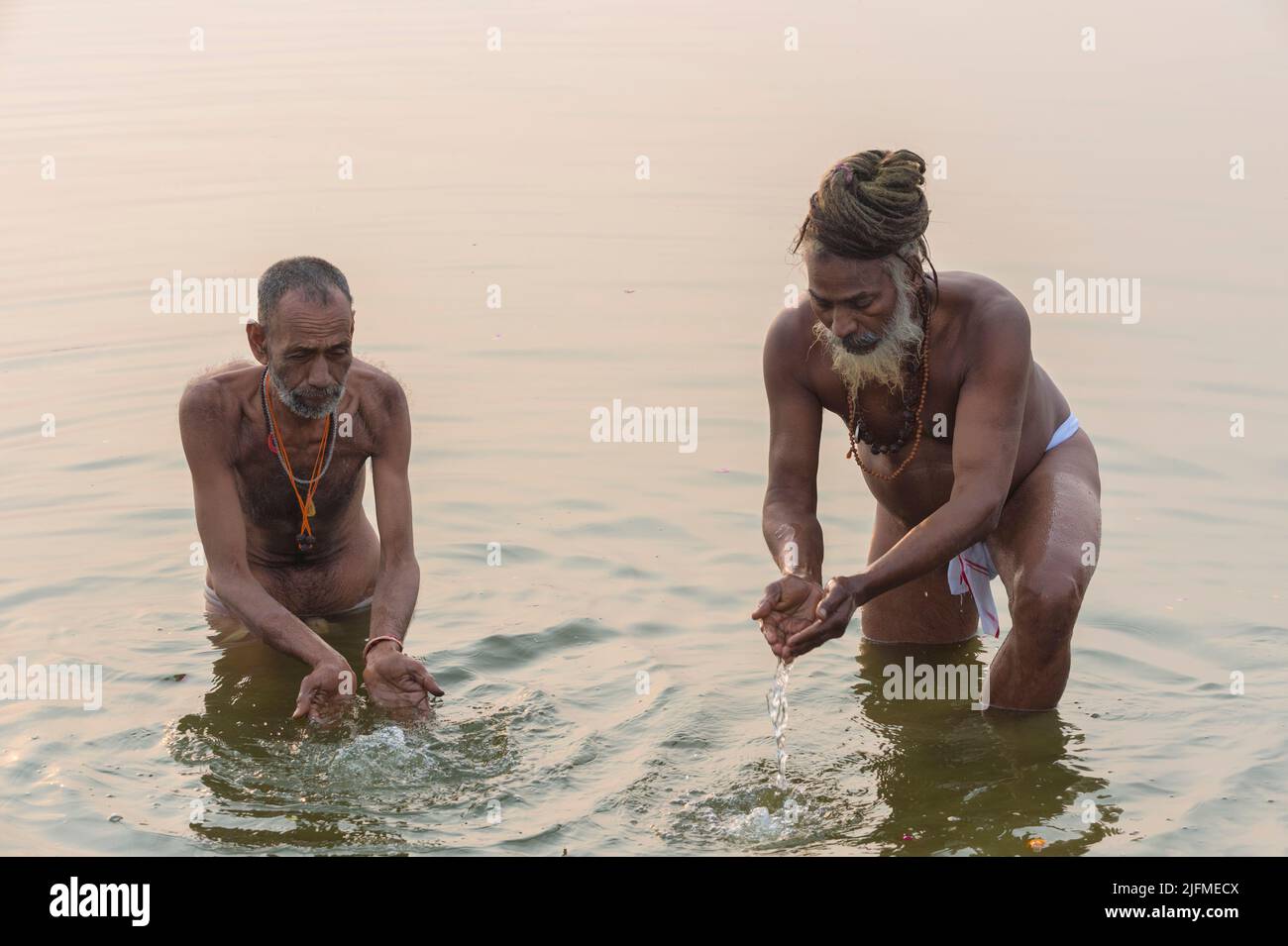 Rome baba and Sadhu bathing in the Ganges River at sunrise, For Editorial Use Only, Allahabad Kumbh Mela, World’s largest religious gathering, Uttar P Stock Photo