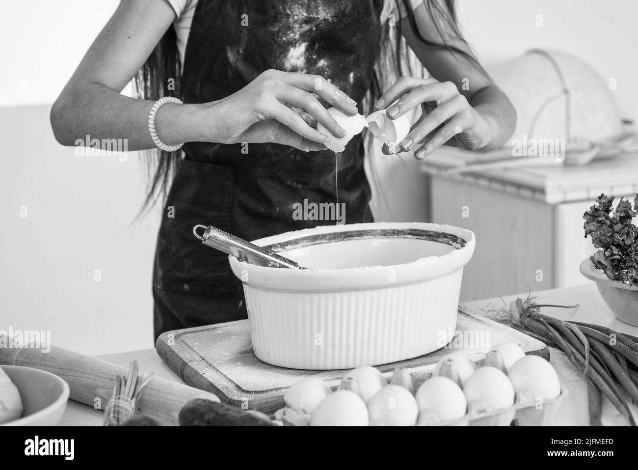 kid beating egg and flour for making dough with beater, food Stock