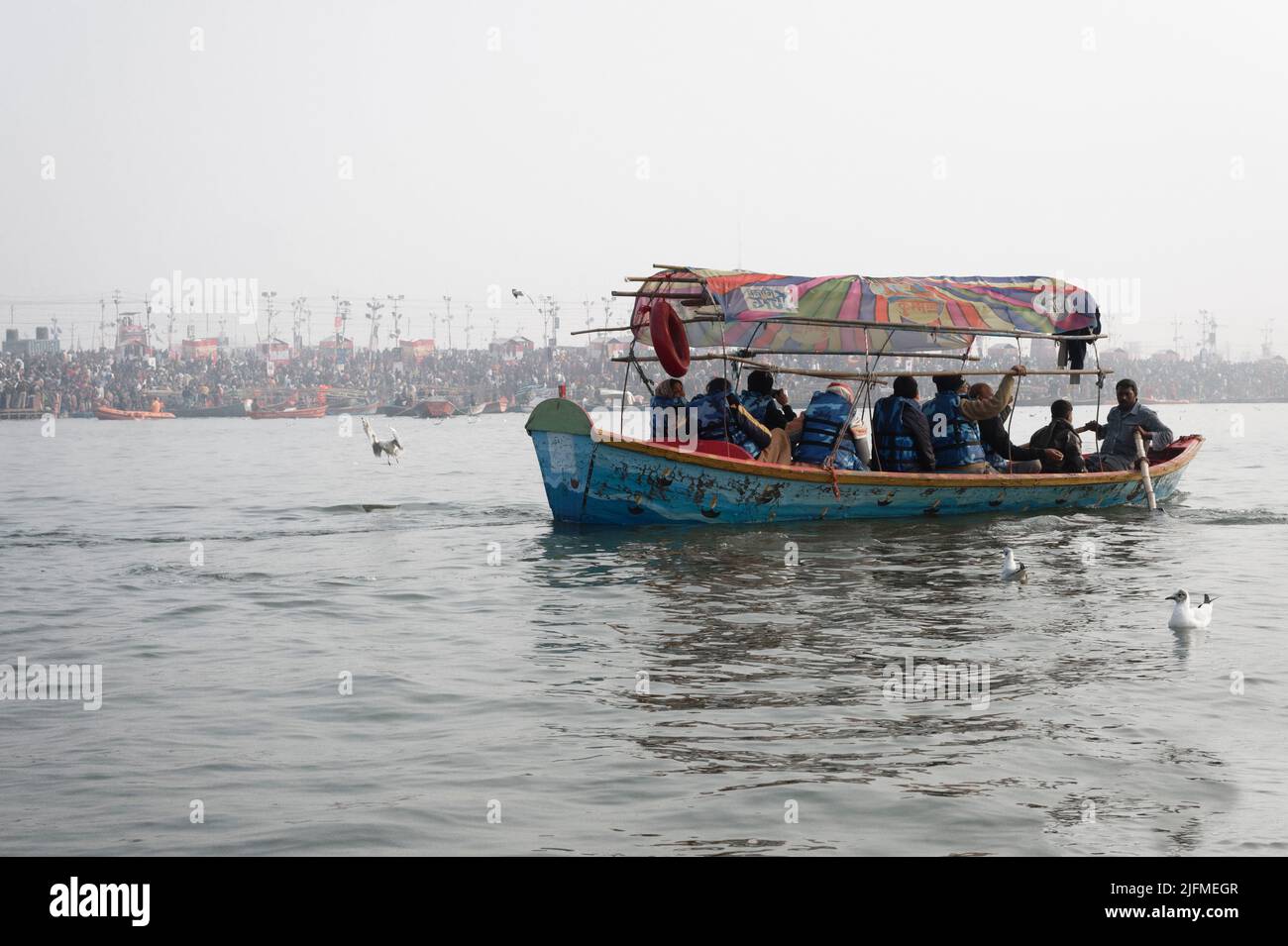 Pilgrims on boats at early morning, Allahabad Kumbh Mela, World’s largest religious gathering, Uttar Pradesh, India Stock Photo