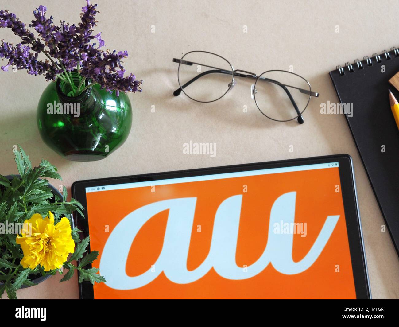 Germany. 04th July, 2022. In this photo illustration, au by KDDI, a Japanese mobile phone operator logo seen displayed on a tablet. Credit: SOPA Images Limited/Alamy Live News Stock Photo