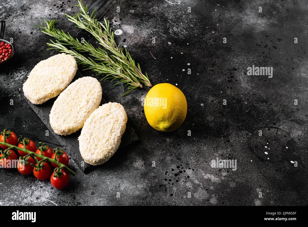 Fishcake burger , on black dark stone table background, top view flat ...