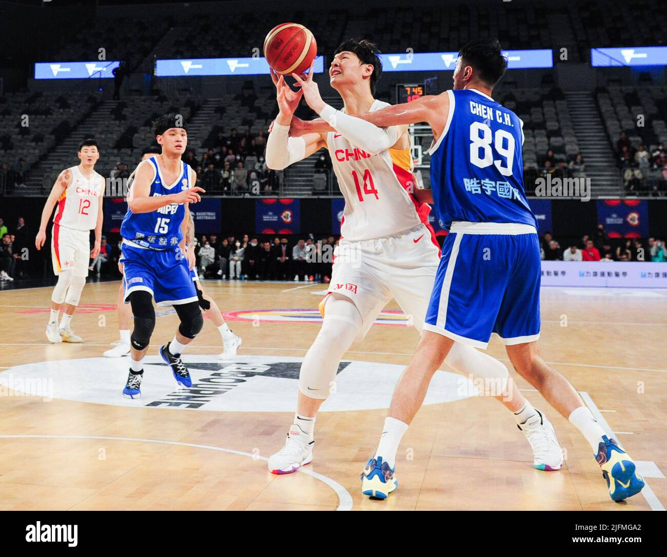Melbourne, Australia. 4th July, 2022. Wang Zhelin (2nd R) of China vies with Chen Chao Hao (1st R) of Chinese Taipei during a Group B match between China and Chinese Taipei of the FIBA World Cup Asian qualifiers in Melbourne, Australia, July 4, 2022. Credit: Bai Xue/Xinhua/Alamy Live News Stock Photo