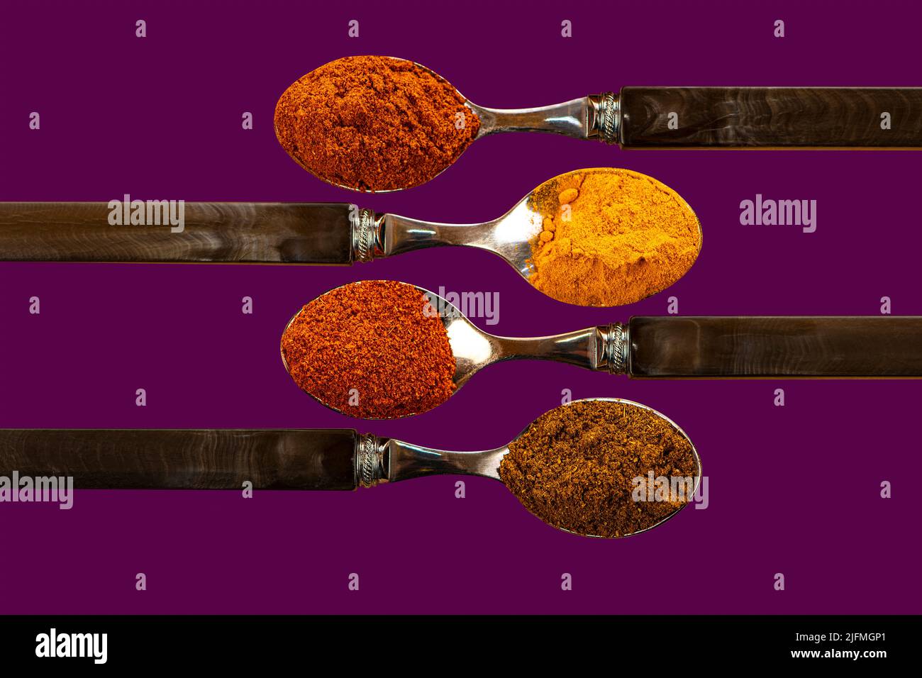 A selection of cayenne pepper turmeric chili curry powder spices used