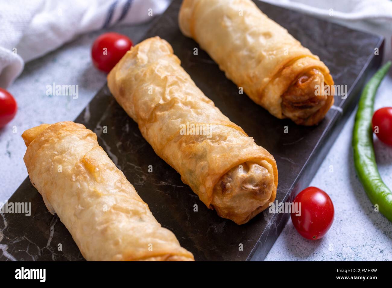 Pacanga pastry. Turkish Pacanga Boregi with pastirma (pastrami) and