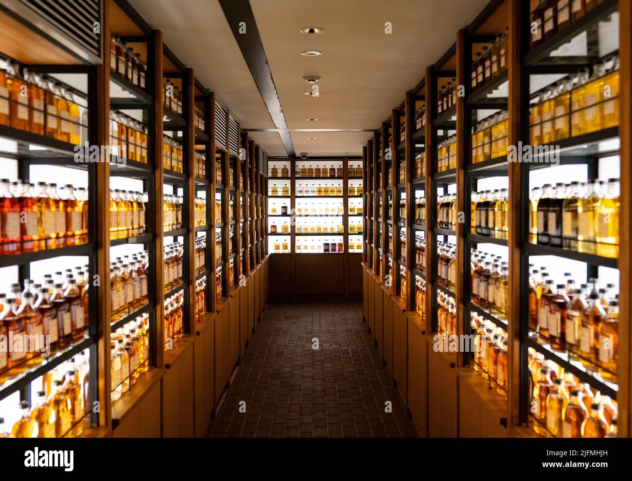 A bunch of various whiskeys on the shelves in the Whisky Library in